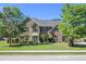 Charming two-story brick home with lush landscaping and a manicured lawn at 4765 Smokestone Dr, Douglasville, GA 30135