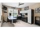View of a home office area with carpet, a ceiling fan, and a large workstation at 4765 Smokestone Dr, Douglasville, GA 30135