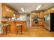 Well-equipped kitchen featuring stainless steel appliances, ample wooden cabinetry, and sleek countertops at 4765 Smokestone Dr, Douglasville, GA 30135