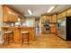 Well-equipped kitchen with stainless steel appliances, wood cabinets and hardwood floors, a cozy breakfast bar at 4765 Smokestone Dr, Douglasville, GA 30135