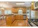 Functional kitchen with wood cabinetry, stainless steel appliances, and a breakfast nook at 4765 Smokestone Dr, Douglasville, GA 30135