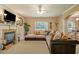 Bright and inviting living room featuring a fireplace and ample seating at 4765 Smokestone Dr, Douglasville, GA 30135