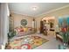 Inviting living room with cozy seating area, colorful rug, and stylish decor at 4765 Smokestone Dr, Douglasville, GA 30135