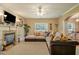 Spacious living room features a cozy fireplace and comfortable seating, great for relaxing and entertaining at 4765 Smokestone Dr, Douglasville, GA 30135