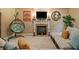 Cozy living room showcasing a fireplace, hanging chair, and comfortable sectional sofa, perfect for relaxation at 4765 Smokestone Dr, Douglasville, GA 30135