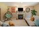 Comfortable living room features a fireplace, large sectional sofa, and a hanging chair at 4765 Smokestone Dr, Douglasville, GA 30135