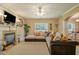 Inviting living room featuring a fireplace, comfortable seating, and natural light at 4765 Smokestone Dr, Douglasville, GA 30135