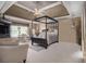 Spacious main bedroom featuring a four-poster bed and sitting area at 4765 Smokestone Dr, Douglasville, GA 30135