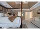 Open primary bedroom with four-poster bed, sitting area, and access to the en suite bathroom at 4765 Smokestone Dr, Douglasville, GA 30135