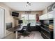 Well-lit home office with stylish desk, modern lighting and black and white decor at 4765 Smokestone Dr, Douglasville, GA 30135