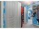Interior of walk-in closet with built-in shelving, storage and an arched doorway at 4765 Smokestone Dr, Douglasville, GA 30135