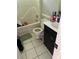 Bathroom with black vanity, white toilet, and shower/tub combo at 615 Amberwood Pl, Euharlee, GA 30145