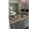 Bathroom featuring a double sink vanity, and a large mirror at 615 Amberwood Pl, Euharlee, GA 30145