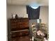 Bedroom with chest of drawers, a dog cage and a window at 615 Amberwood Pl, Euharlee, GA 30145