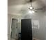 Bedroom with gray walls, ceiling fan and dark furniture at 615 Amberwood Pl, Euharlee, GA 30145