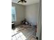 Bedroom with light-colored wood floors and natural light from a window at 615 Amberwood Pl, Euharlee, GA 30145