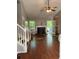 Spacious living room with hardwood floors, fireplace, and access to the backyard at 615 Amberwood Pl, Euharlee, GA 30145