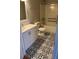 Updated bathroom featuring patterned tile floors and a shower-tub combo at 1651 Massachusetts Sw Ave # 1, Marietta, GA 30008