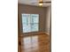 Bright bedroom with a window, ceiling fan, and hardwood floors at 1651 Massachusetts Sw Ave # 1, Marietta, GA 30008