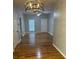 Spacious living room with hardwood floors, ceiling fan, and ample natural light at 1651 Massachusetts Sw Ave # 1, Marietta, GA 30008
