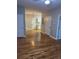 Open floor plan featuring hardwood floors and natural light, leading to the kitchen at 1651 Massachusetts Sw Ave # 1, Marietta, GA 30008