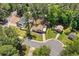 Scenic aerial shot of a cozy home nestled in a lush neighborhood with mature trees and well-manicured lawns at 3050 Woodland Nw Dr, Kennesaw, GA 30152