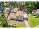 Aerial view of a charming home with a spacious backyard, partially fenced, complemented by an open deck at 3050 Woodland Nw Dr, Kennesaw, GA 30152