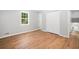 This bedroom is complete with hardwood flooring, neutral paint and closet space for ample storage at 3050 Woodland Nw Dr, Kennesaw, GA 30152