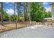 Large deck surrounded by mature trees and nature, perfect for entertaining or relaxing outdoors at 3050 Woodland Nw Dr, Kennesaw, GA 30152