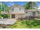 Rear exterior of a home showcasing a spacious outdoor deck and patio, perfect for entertaining, plus backyard at 3050 Woodland Nw Dr, Kennesaw, GA 30152