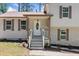 Charming single Gathering home with detailed front door and traditional shutters on the windows at 3050 Woodland Nw Dr, Kennesaw, GA 30152