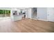 Open concept living space featuring an updated kitchen with stainless steel appliances and a granite island at 3050 Woodland Nw Dr, Kennesaw, GA 30152