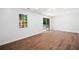 Bright room with new hardwood flooring and sliding glass doors that lead to the back deck at 3050 Woodland Nw Dr, Kennesaw, GA 30152