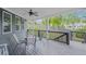 Covered back porch with seating and a view of the yard at 4035 Pinebrook Cir, Cumming, GA 30028