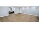 Spacious finished basement with wood floors, white trim, and light blue walls at 4035 Pinebrook Cir, Cumming, GA 30028