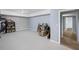 Unfinished basement with grey walls, boxes, and a doorway to a finished area at 4035 Pinebrook Cir, Cumming, GA 30028