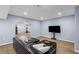 This finished basement features a large sectional and tv for comfortable relaxation at 4035 Pinebrook Cir, Cumming, GA 30028
