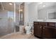 This bathroom features a glass enclosed shower, vanity with sink, and great natural light at 4035 Pinebrook Cir, Cumming, GA 30028