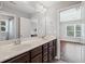 Lovely bathroom with dual sinks and access to other rooms at 4035 Pinebrook Cir, Cumming, GA 30028