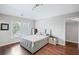 This contemporary bedroom features wood floors and great natural light from a large window at 4035 Pinebrook Cir, Cumming, GA 30028