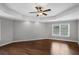 Bedroom features wood flooring, a ceiling fan, and neutral paint at 4035 Pinebrook Cir, Cumming, GA 30028