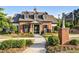 Charming brick clubhouse at The Retreat, featuring manicured lawns and a welcoming entrance at 4035 Pinebrook Cir, Cumming, GA 30028