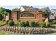 Elegant brick community sign for Williams Point, surrounded by manicured landscaping and seasonal flowers at 4035 Pinebrook Cir, Cumming, GA 30028