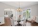 Dining room and office area with hardwood floors, great lighting, and archway detail at 4035 Pinebrook Cir, Cumming, GA 30028