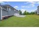 Spacious backyard with manicured lawn and three car garage at 4035 Pinebrook Cir, Cumming, GA 30028