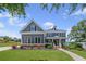Charming two-story home with a landscaped front yard, inviting entryway and classic architectural details at 4035 Pinebrook Cir, Cumming, GA 30028