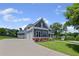 Attractive two-story home featuring a long driveway, a three-car garage, and manicured landscaping at 4035 Pinebrook Cir, Cumming, GA 30028