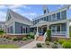 Two-story home with columns, landscaped garden, and brick accent offering classic elegance at 4035 Pinebrook Cir, Cumming, GA 30028