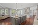 Spacious kitchen featuring an island, stainless steel appliances, and hardwood floors at 4035 Pinebrook Cir, Cumming, GA 30028