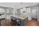 Modern kitchen with an island, stainless steel appliances, and gray and white cabinets at 4035 Pinebrook Cir, Cumming, GA 30028